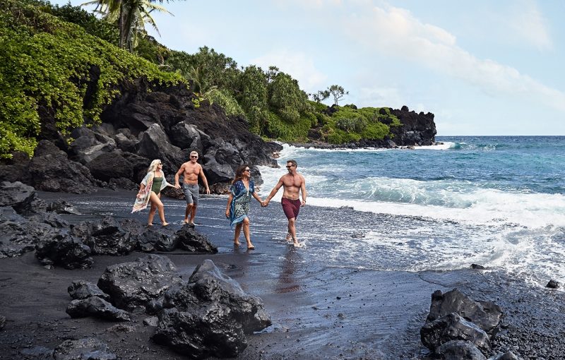 Two couples walking on beach