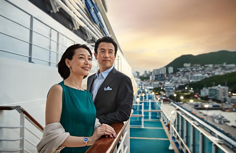 Couple in formal dress on deck of ship