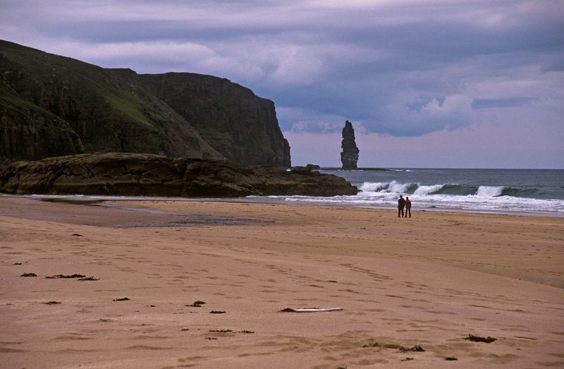 Two people on beach in Sandwood Bay