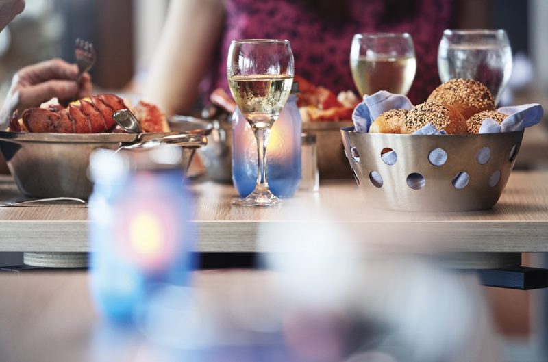 A close up of a dining table with seafood onboard Princess