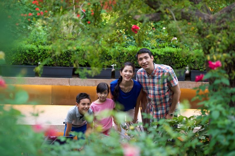 A family looking at the flowers in Gardens by the Bay Singapore