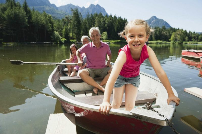 Grandfather and granddaughter on a canoe