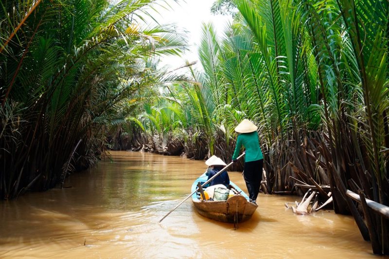 Two people in a boat on the Mekong Delta Vietnam