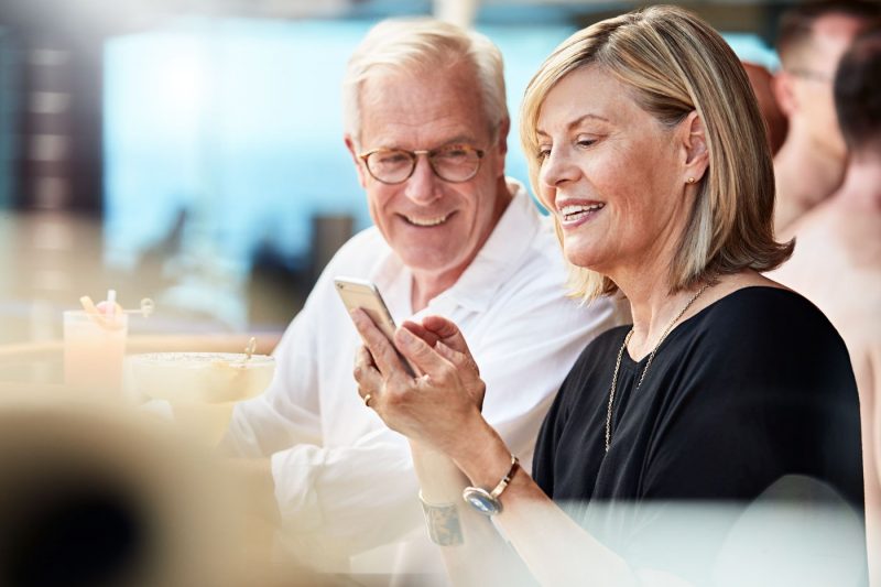 A couple looking at their phone