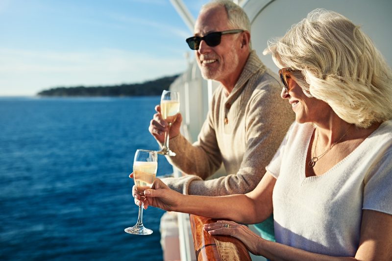 Couple enjoying champagne on a balcony