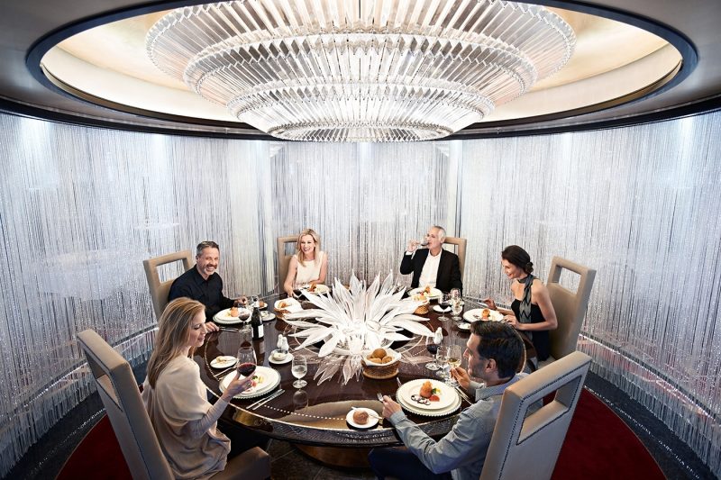 Group of six people eating dinner