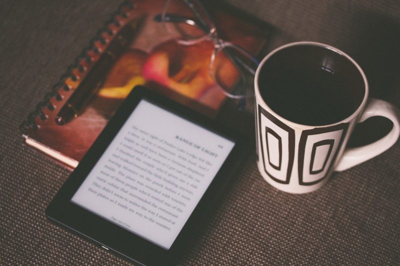 A kindle and a coffee still life