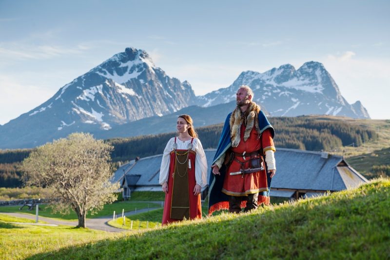 Two people in historic dress at the Lofotr Viking Museum in the Lofoten Islands