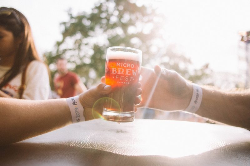 Two people holding beer