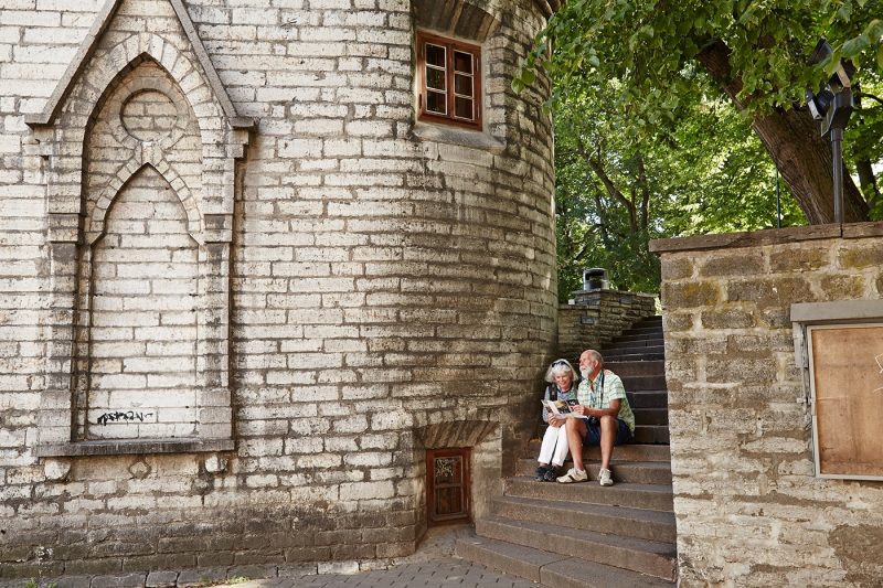 Couple sitting in Old Town, Tallinn