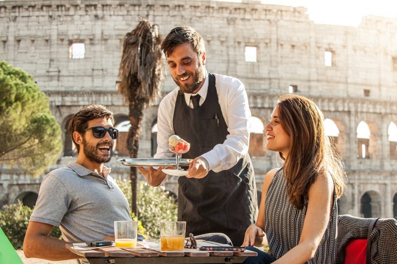 Couple being served ice cream in Rome