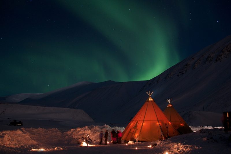 Northern lights in a tent in Svalbard