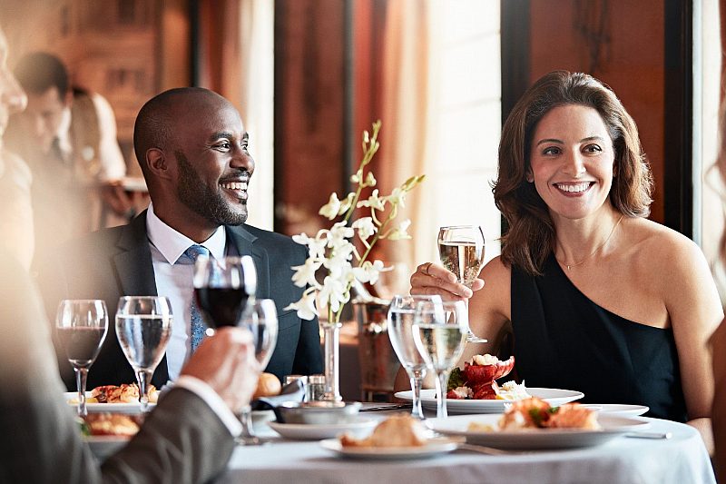 People enjoying themselves in the dining room onboard Regal Princess