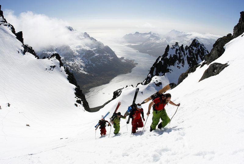 Four people hiking in Lofoten Fjords