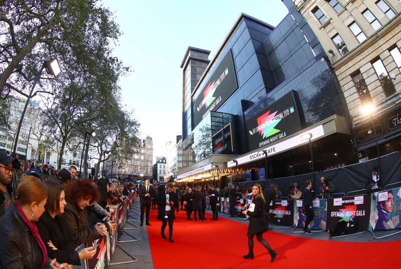 Crowd of people outside cinema