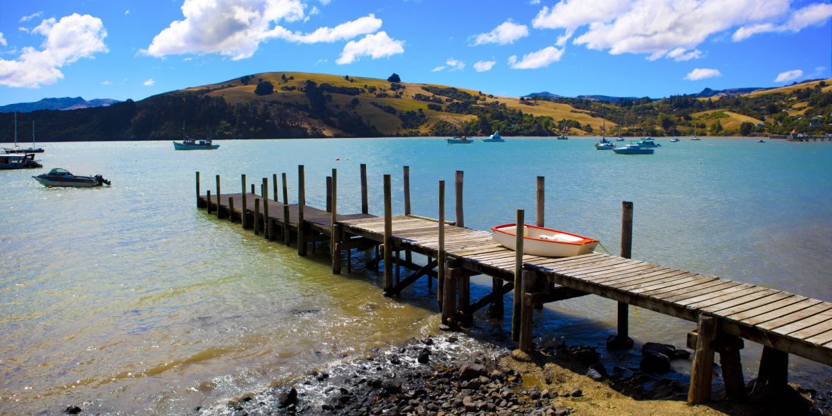 Jetty in water in Akaroa, South Island, New Zealand