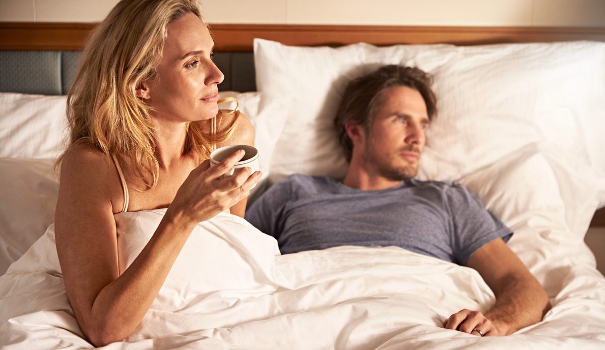Couple In Bed with coffee