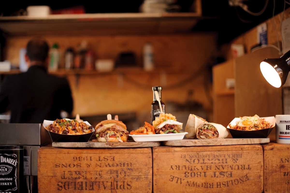 Selection of street food on wooden boards