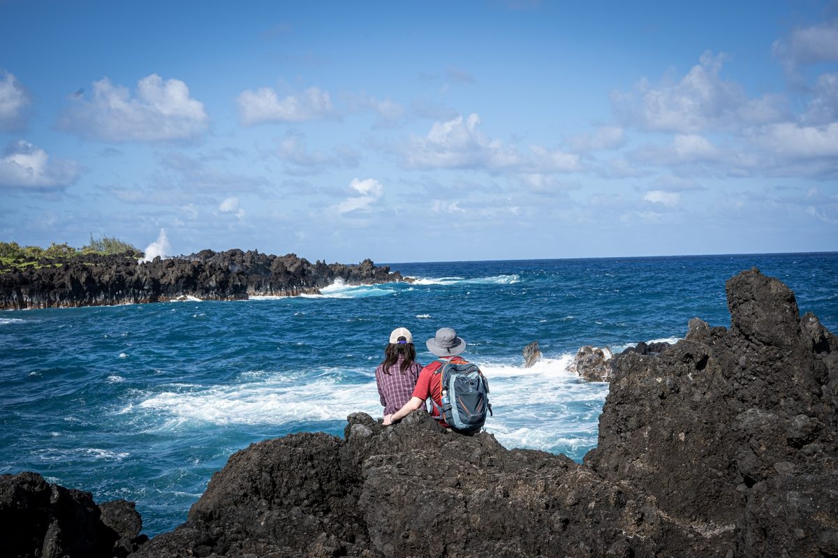 Two people looking out to sea