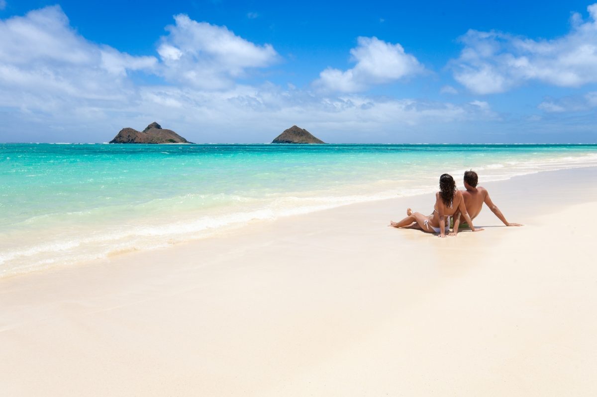 Romantic couple on a tropical beach in Oahu, Hawaii.