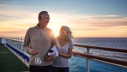 Couple at dreamy sunset on ship