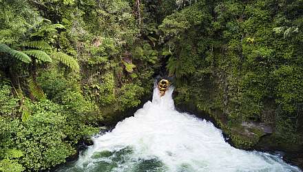Raft going over waterfall in New Zealand